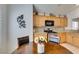 Charming kitchen with wood cabinetry, granite countertops, and stainless steel appliances at 6 Sandwedge Dr, Henderson, NV 89074
