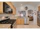 Bright kitchen features stainless steel appliances, light wood cabinets and granite countertops at 6 Sandwedge Dr, Henderson, NV 89074
