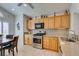 Well-lit kitchen with wood cabinets, stainless steel appliances, and a cozy dining area at 6 Sandwedge Dr, Henderson, NV 89074