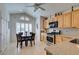 Eat-in kitchen area boasts natural light with white shutters, stainless steel appliances, and tile floors at 6 Sandwedge Dr, Henderson, NV 89074