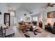 Bright living room featuring wood floors, a vaulted ceiling, and an open floor plan at 6 Sandwedge Dr, Henderson, NV 89074