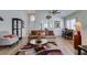 Bright living room with vaulted ceilings, wood floors, and a cozy seating area with plenty of light at 6 Sandwedge Dr, Henderson, NV 89074