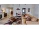 Open-concept living room with wood floors, vaulted ceilings, and comfortable seating at 6 Sandwedge Dr, Henderson, NV 89074