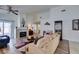 Large living room features vaulted ceilings, wood floors, a fireplace, and outdoor access at 6 Sandwedge Dr, Henderson, NV 89074