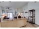Inviting living room featuring a fireplace, light wood floors, and access to the backyard at 6 Sandwedge Dr, Henderson, NV 89074