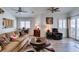 Bright and airy living room with wood floors, vaulted ceilings, and plenty of seating options at 6 Sandwedge Dr, Henderson, NV 89074