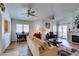 Inviting living room with vaulted ceilings, wood floors, fireplace, and access to the patio at 6 Sandwedge Dr, Henderson, NV 89074