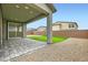 Covered patio featuring pavers, a green pillar, and sliding glass door at 6830 Fallen Rock St, North Las Vegas, NV 89084