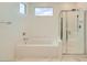 Bright bathroom featuring separate tub and shower with tile surround at 6830 Fallen Rock St, North Las Vegas, NV 89084