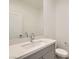 Modern bathroom featuring vanity with sink and quartz countertop with natural lighting at 6830 Fallen Rock St, North Las Vegas, NV 89084