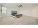 Large primary bedroom offers a ceiling fan and large windows for natural lighting at 6830 Fallen Rock St, North Las Vegas, NV 89084