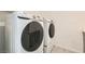 Convenient laundry room featuring modern washer and dryer units at 6830 Fallen Rock St, North Las Vegas, NV 89084