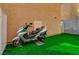 Backyard featuring artificial turf next to the exterior wall of the house at 687 Porchtown Ave, Las Vegas, NV 89183