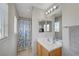 Bright bathroom showcasing a vanity, mirror, tile floor, and natural light at 687 Porchtown Ave, Las Vegas, NV 89183
