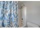 Bathroom bathtub-shower combination with blue and white floral shower curtain at 687 Porchtown Ave, Las Vegas, NV 89183