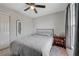 Comfortable bedroom showcasing natural light, a sleek ceiling fan, and space-saving design at 687 Porchtown Ave, Las Vegas, NV 89183