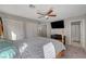 Bedroom with four poster bed, ceiling fan, closet, and en suite bathroom at 687 Porchtown Ave, Las Vegas, NV 89183