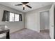 Relaxing bedroom featuring carpet, a window, and a closet with sliding doors at 687 Porchtown Ave, Las Vegas, NV 89183