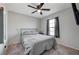 Comfortable bedroom showcasing natural light, a sleek ceiling fan, and space-saving design at 687 Porchtown Ave, Las Vegas, NV 89183