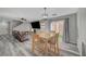 Open floor plan featuring luxury vinyl plank flooring, dining area, and comfortable living area at 687 Porchtown Ave, Las Vegas, NV 89183