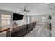 Open-concept living room with modern furnishings, wood-look floors, and plenty of natural light at 687 Porchtown Ave, Las Vegas, NV 89183
