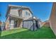 Large backyard featuring artificial turf and a gazebo at 688 Monroe Hill Pl, Henderson, NV 89011