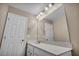 Well-lit bathroom features quartz counters, a large mirror, and neutral paint at 688 Monroe Hill Pl, Henderson, NV 89011
