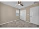 Clean bedroom with plush carpet, a ceiling fan, closet and one window at 688 Monroe Hill Pl, Henderson, NV 89011