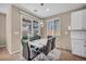 Dining area boasts modern lighting and easy access to the outdoor patio, perfect for entertaining at 688 Monroe Hill Pl, Henderson, NV 89011