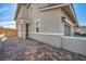 Two-story home with brick driveway and mature landscaping in the front yard, with a two car garage at 688 Monroe Hill Pl, Henderson, NV 89011