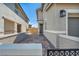 Charming two-story home with brick driveway and mature landscaping, features a side door and a two car garage at 688 Monroe Hill Pl, Henderson, NV 89011
