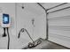 Inside a garage with an EV charger and white walls at 688 Monroe Hill Pl, Henderson, NV 89011