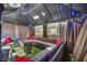 Outdoor gazebo with sectional seating, throw pillows, coffee table, and string lights at 688 Monroe Hill Pl, Henderson, NV 89011