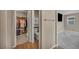Hallway with a closet, toilet and view of the bedroom with a TV at 688 Monroe Hill Pl, Henderson, NV 89011