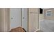 Hallway with a bedroom view, doors and wood flooring at 688 Monroe Hill Pl, Henderson, NV 89011