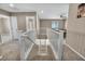Hallway features white railing, neutral walls, and carpet at 688 Monroe Hill Pl, Henderson, NV 89011