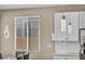 Kitchen area showcasing modern pendant lights and a window at 688 Monroe Hill Pl, Henderson, NV 89011