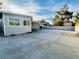 Large backyard space featuring a covered patio and concrete area for outdoor activities at 700 N Minnesota St, Las Vegas, NV 89107