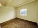 Cozy bedroom with neutral paint, carpet and a window allowing natural light at 700 N Minnesota St, Las Vegas, NV 89107
