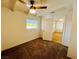 Bedroom with a ceiling fan, carpet, white walls, and natural light at 700 N Minnesota St, Las Vegas, NV 89107
