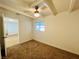 Bedroom featuring a ceiling fan, window, neutral paint, carpet and closet at 700 N Minnesota St, Las Vegas, NV 89107