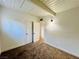 Carpeted bedroom featuring ample closet space and white walls at 700 N Minnesota St, Las Vegas, NV 89107