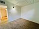 Bright carpeted bedroom with white walls, a closet and an open entry at 700 N Minnesota St, Las Vegas, NV 89107