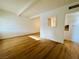 Open-concept living space showcasing hardwood floors and a view into the kitchen at 700 N Minnesota St, Las Vegas, NV 89107