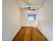 Bright living area with hardwood floors, a ceiling fan, and a window at 700 N Minnesota St, Las Vegas, NV 89107