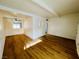 Well-lit living area with hardwood floors and access to other rooms at 700 N Minnesota St, Las Vegas, NV 89107