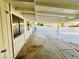 Covered patio area offering shade and space for outdoor entertaining, with a view of the backyard at 700 N Minnesota St, Las Vegas, NV 89107