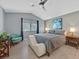 Comfortable bedroom featuring stylish decor and a ceiling fan at 701 Wheat Ridge Ln # 203, Las Vegas, NV 89145