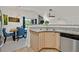 Open-concept kitchen featuring stainless steel dishwasher and light wood cabinets at 701 Wheat Ridge Ln # 203, Las Vegas, NV 89145