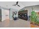 A spacious living room featuring vaulted ceiling, a ceiling fan, stylish built-ins, and plenty of natural light at 701 Wheat Ridge Ln # 203, Las Vegas, NV 89145